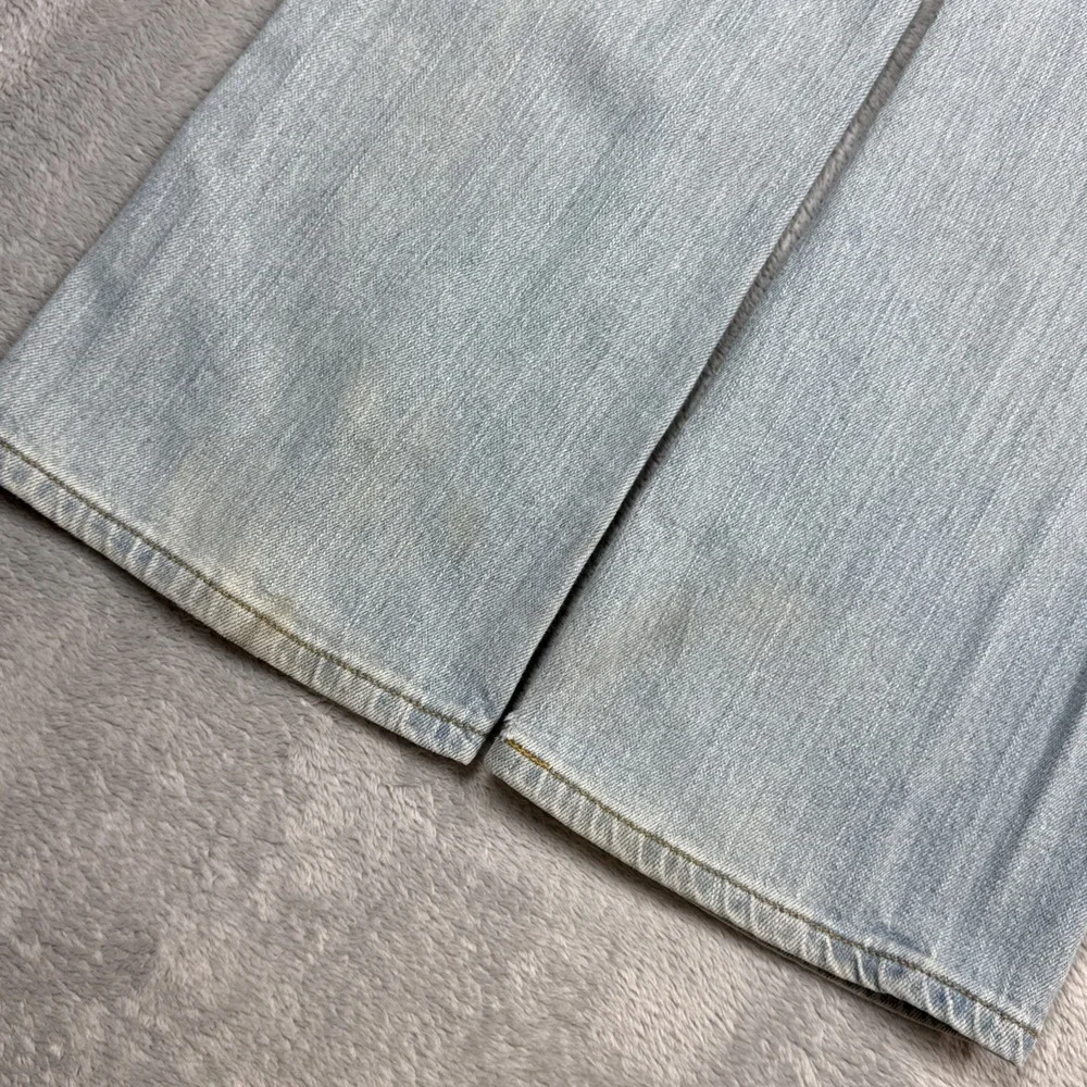 Vintage Levi's 518 Superlow Bootcut Jeans 31x31 Blue Light Wash Low Rise Stained